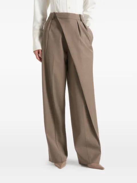Colette in taupe tailored wrap pleat trousers by MANIERE DE VOIR
