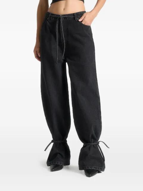 Faye in washed black wide mid rise jeans tie waist by MANIERE DE VOIR