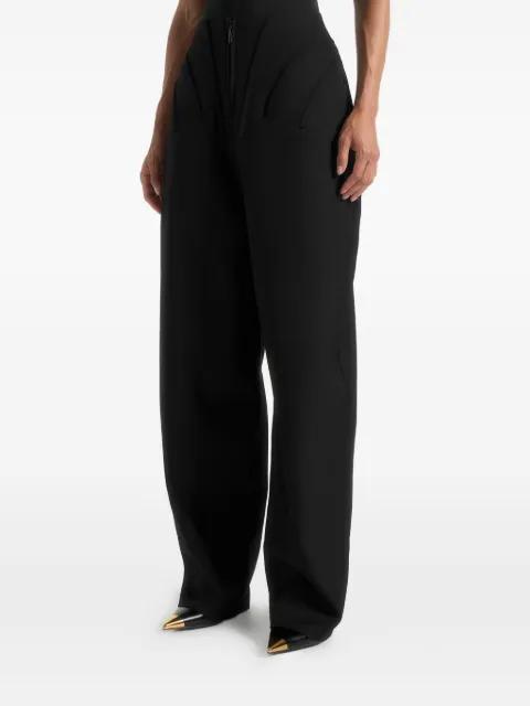 Rena in black high-waisted corset sculptural trousers by MANIERE DE VOIR