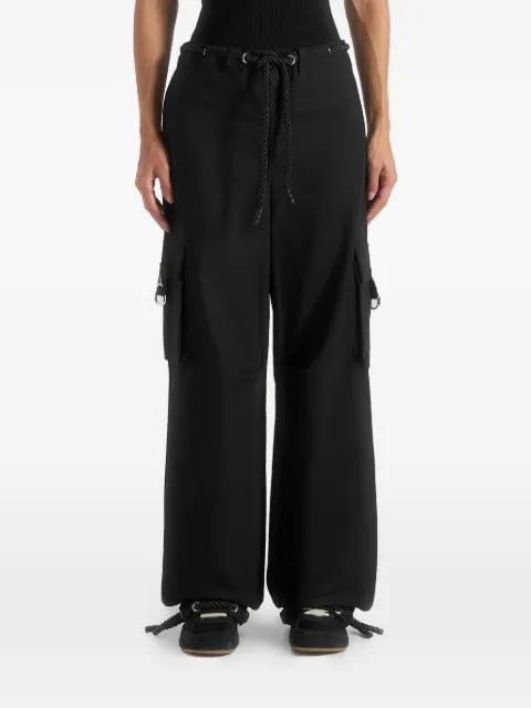 Rosa in black ripstop parachute cargo pants by MANIERE DE VOIR