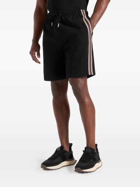 Taylor in black taped cotton shorts by MANIERE DE VOIR