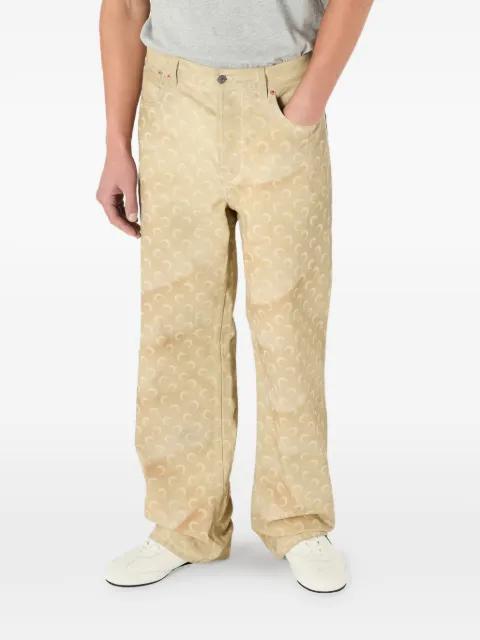 Moon-print faded jeans by MARINE SERRE