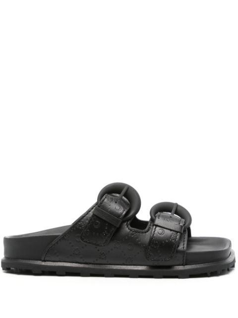 monogram-embossed leather slides by MARINE SERRE