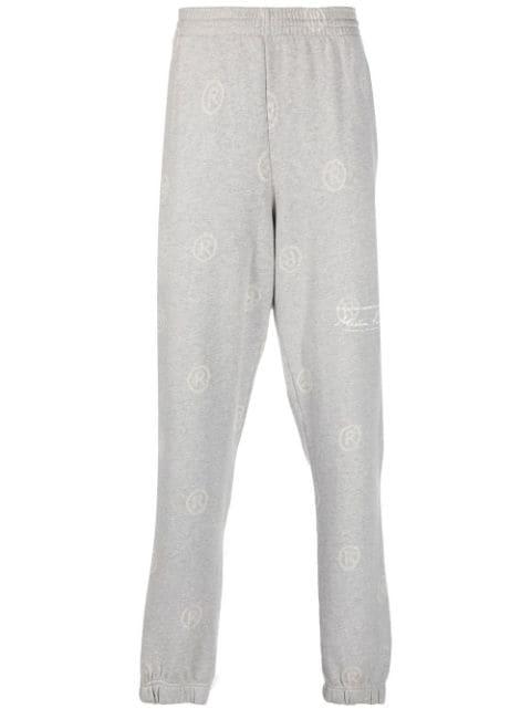 all-over logo-print track pants by MARTINE ROSE