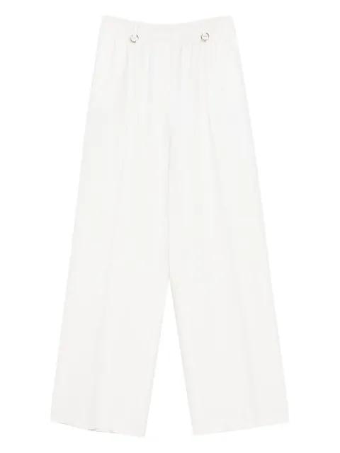 ring-embellished trousers by MEDEEA