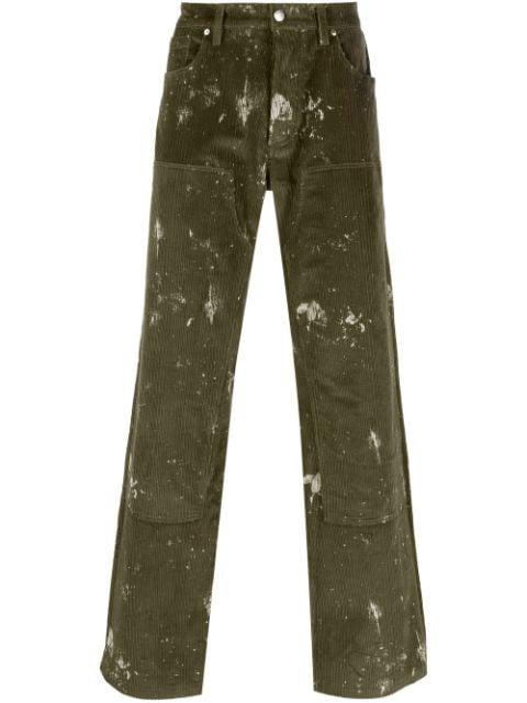paint-splatter corduroy trousers by MISBHV