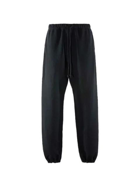 floral-pattern track pants by MONOKEMADE