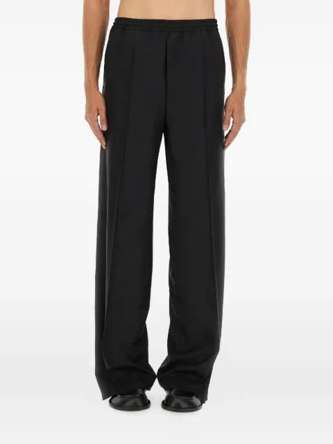 button-embellishment trousers by MOSCHINO