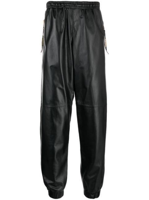 cropped leather track pants by MOSCHINO