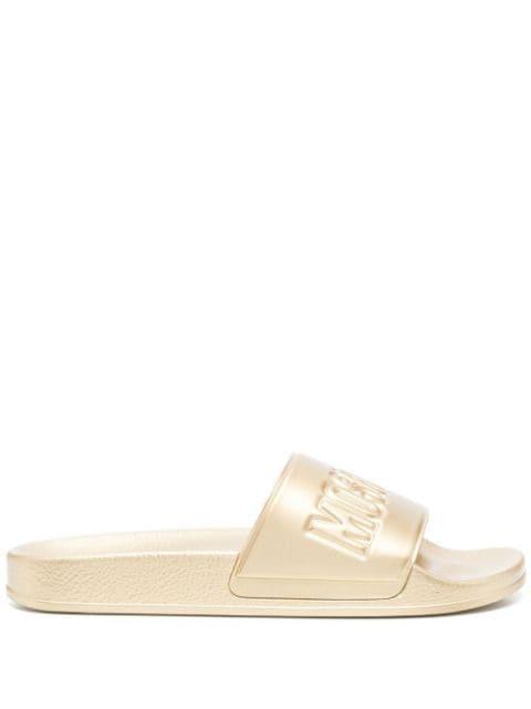 embossed-logo slides by MOSCHINO