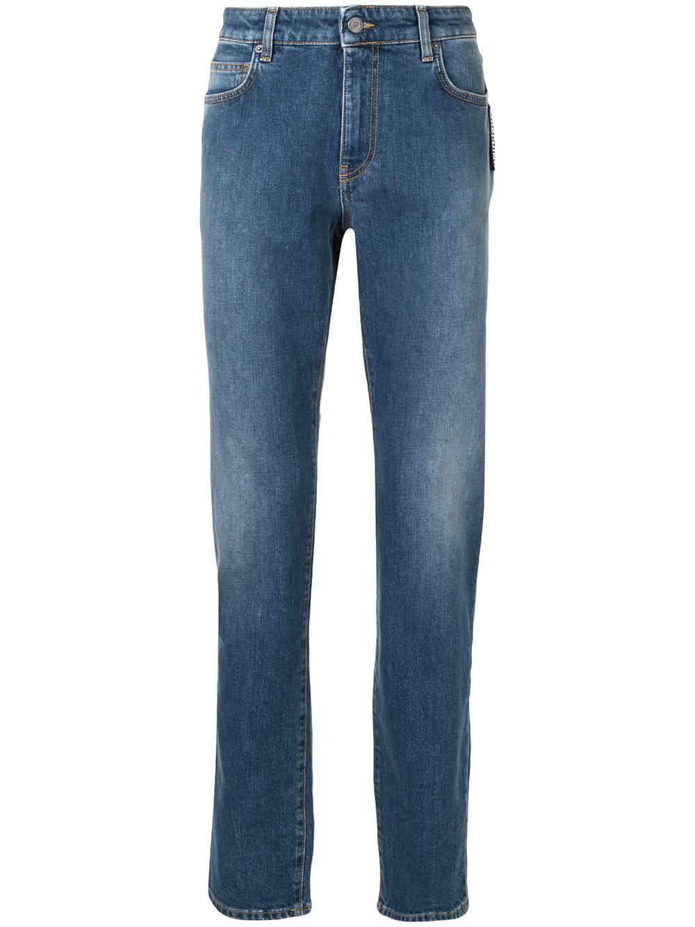 mid-rise stonewashed straight-leg jeans by MOSCHINO