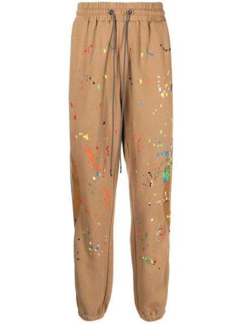 Warped paint-embroidered track pants by MOSTLY HEARD RARELY SEEN