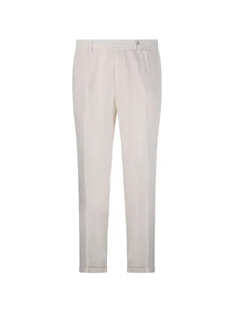 logo-patch trousers by MYTHS
