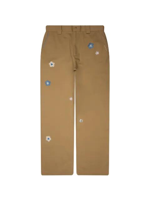 floral-embroidered whipstitch-detail trousers by NAHMIAS