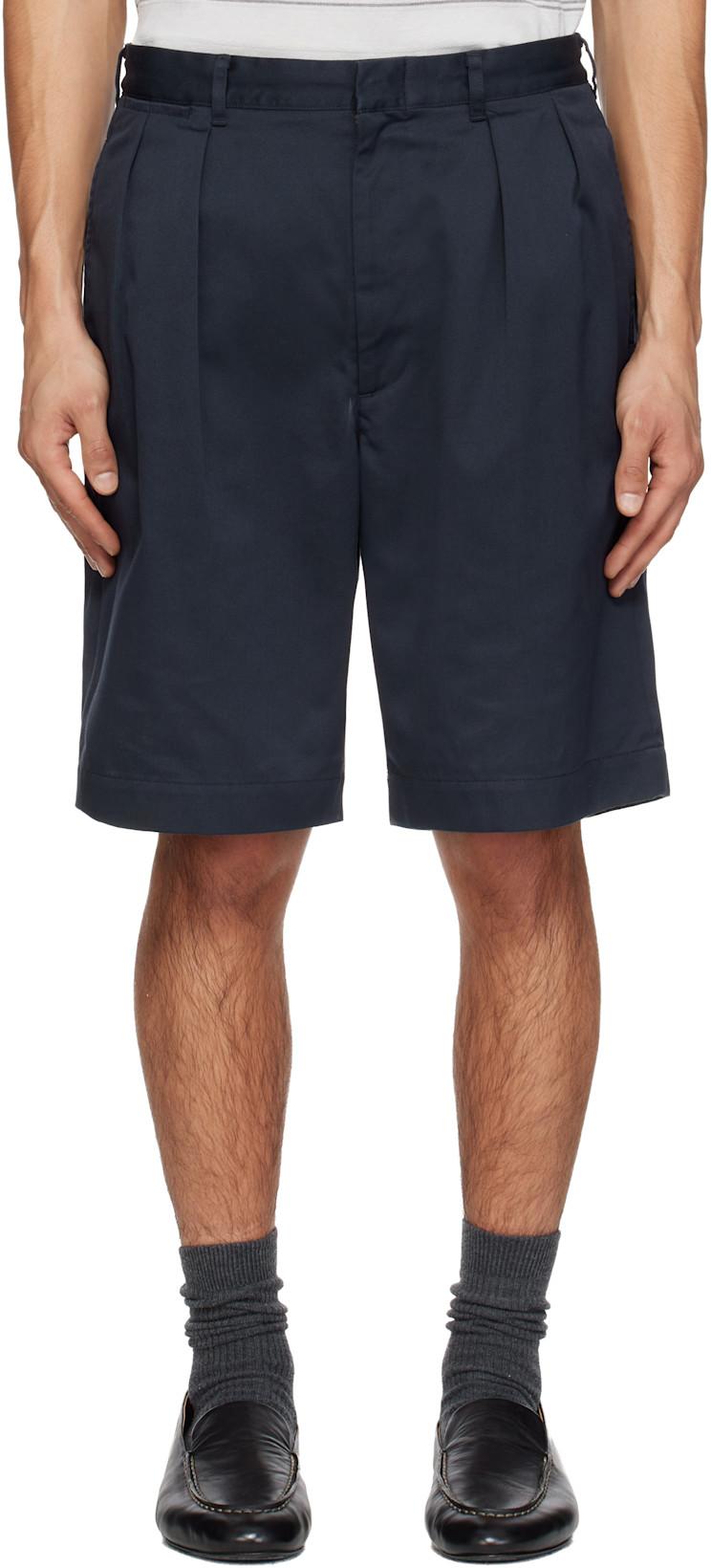 Navy Double Pleated Chino Shorts by NANAMICA