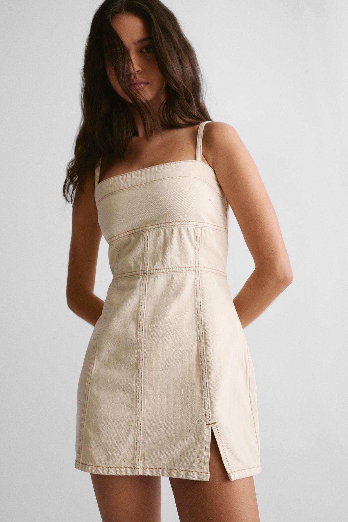 The Denim Strappy Mini Dress by NASTYGAL