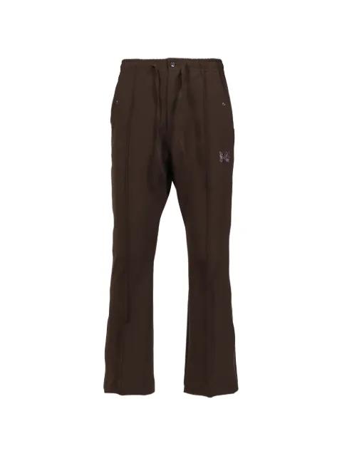 butterfly-embroidered trousers by NEEDLES