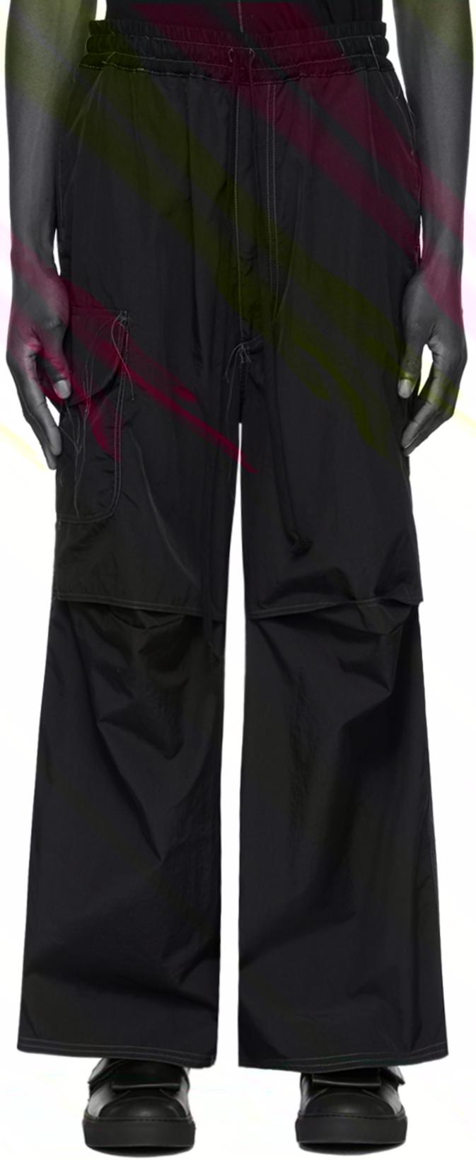 Black Loose Thread Trousers by NICOLAS ANDREAS TARALIS