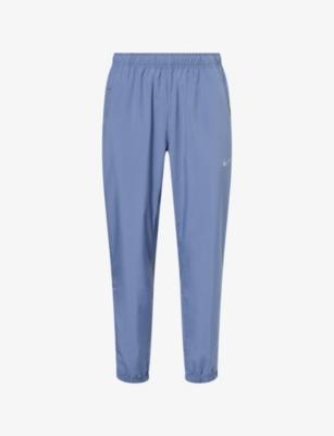 Form Standard-Fit Woven Jogging Bottoms by NIKE
