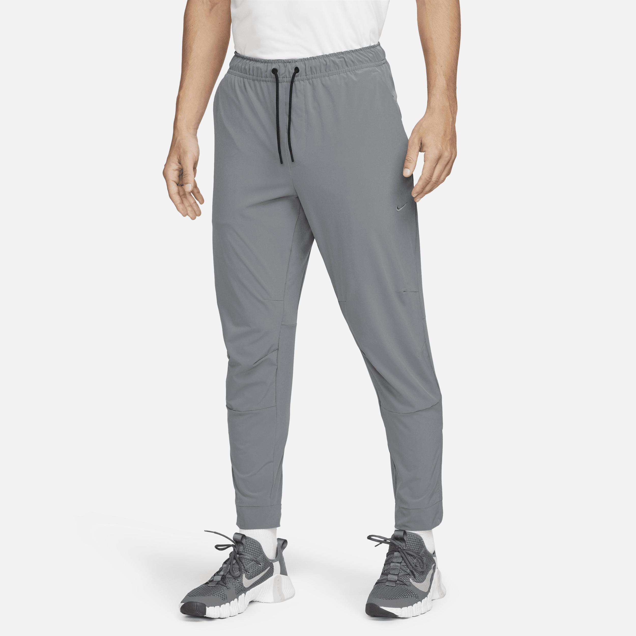 Nike Men's Unlimited Dri-FIT Zippered Cuff Versatile Pants by NIKE