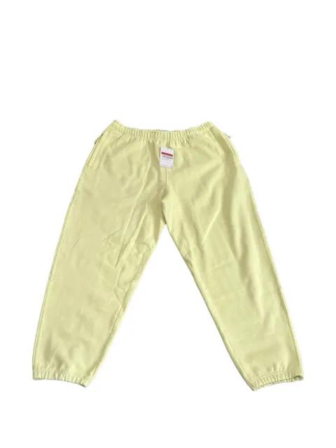 Solo Swoosh fleece track pants by NIKE