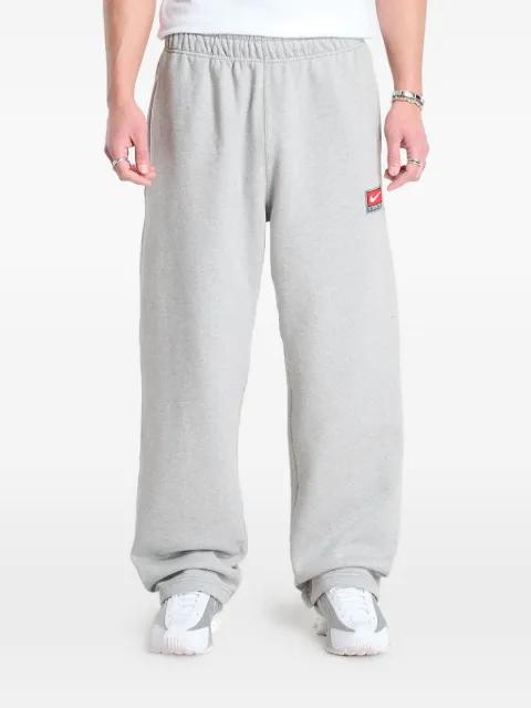 Solo Swoosh open-hem track pants by NIKE
