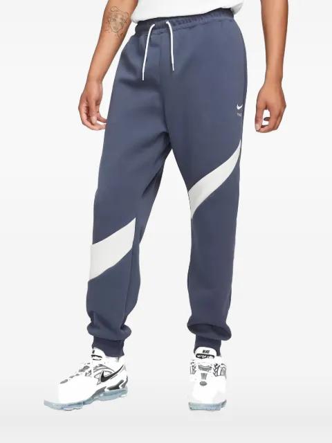 Swoosh tech-fleece track pants by NIKE