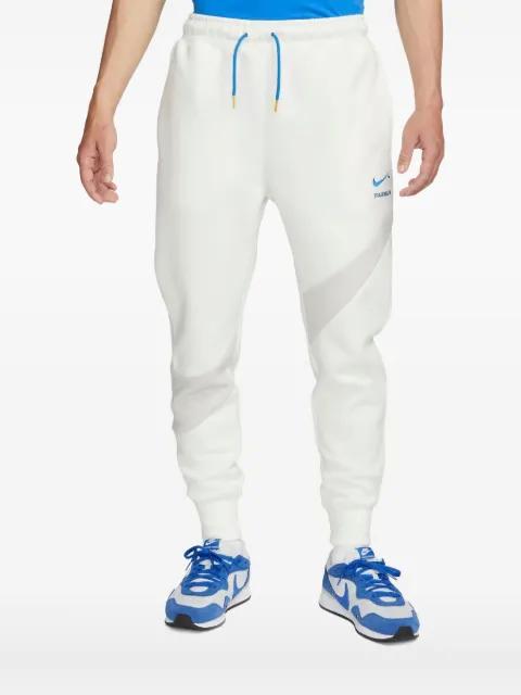 Swoosh tech track pants by NIKE