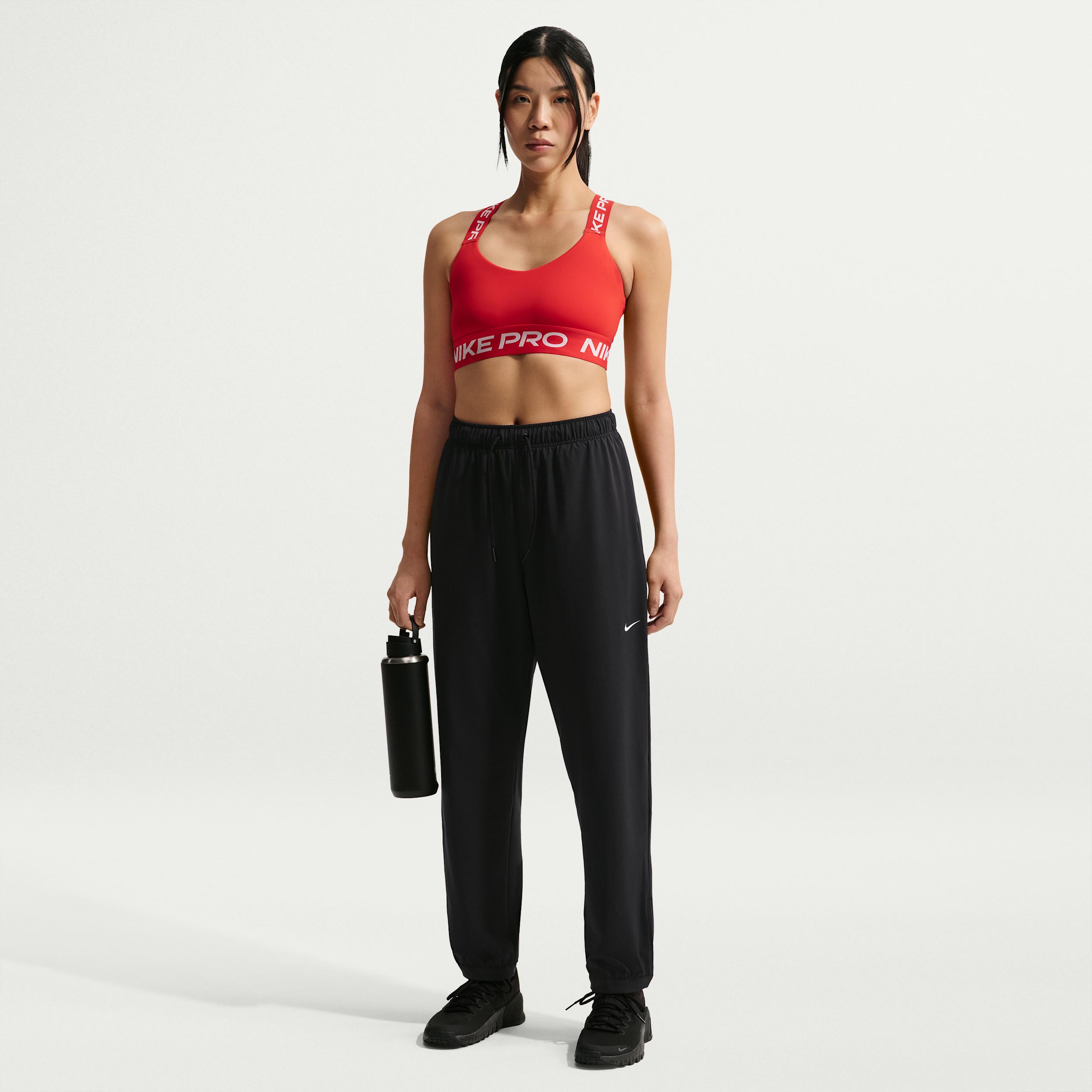 Women's Nike Pro Dri-FIT Mid-Rise Full-Length Woven Pants by NIKE