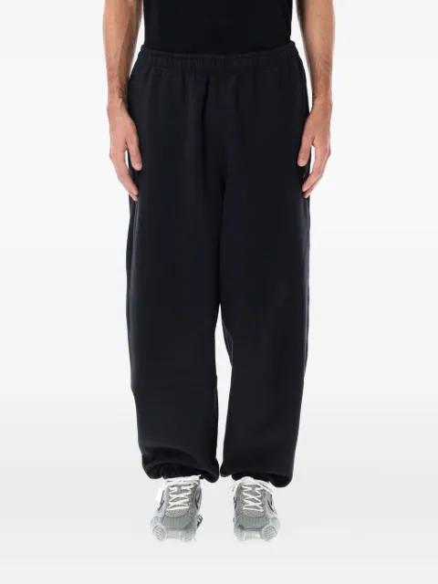 swoosh-embellished track pants by NIKE