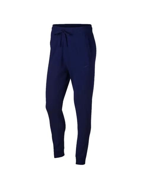 tapered fleece track pants by NIKE