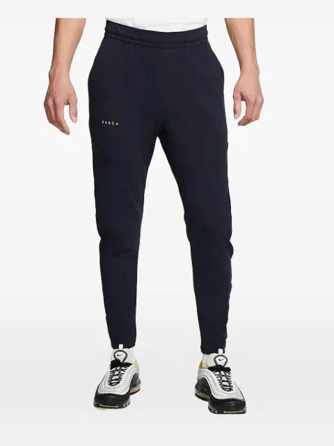 tech pack trousers by NIKE