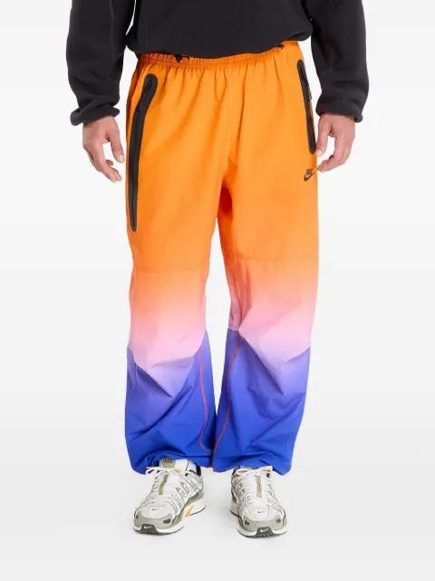 woven track pants by NIKE