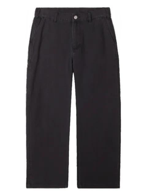 faded-wash trousers by OBEY