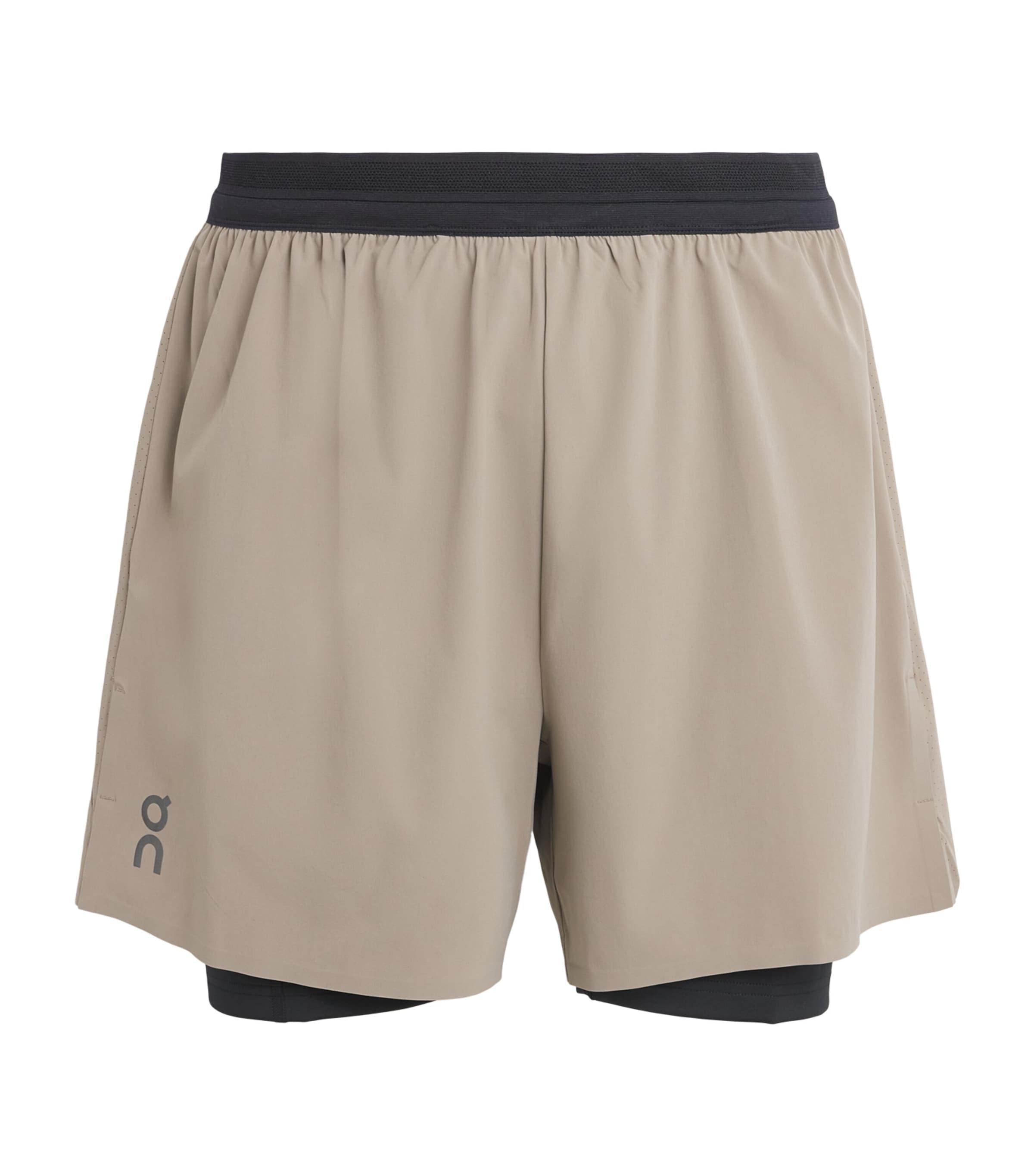 On 2-in-1 Performance Shorts by ON RUNNING