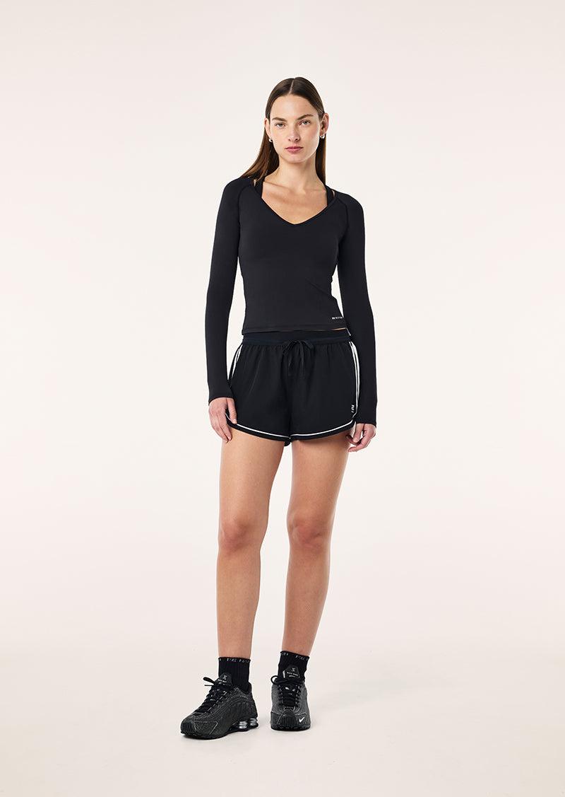 FOUNDATION V NECK LONG SLEEVE TOP IN BLACK by P.E NATION