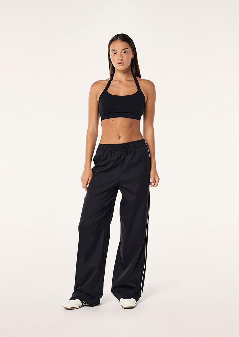UNWIND SPORTS BRA IN BLACK by P.E NATION