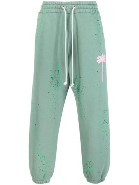 paint-splatter track pants by PALM ANGELS