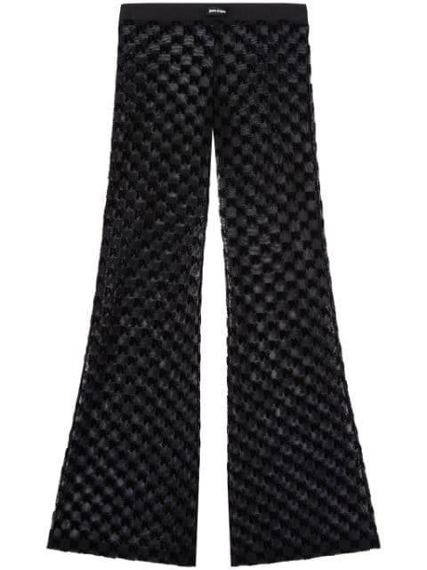 semi-sheer monogram flared trousers by PALM ANGELS