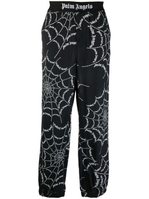 spider web print track pants by PALM ANGELS