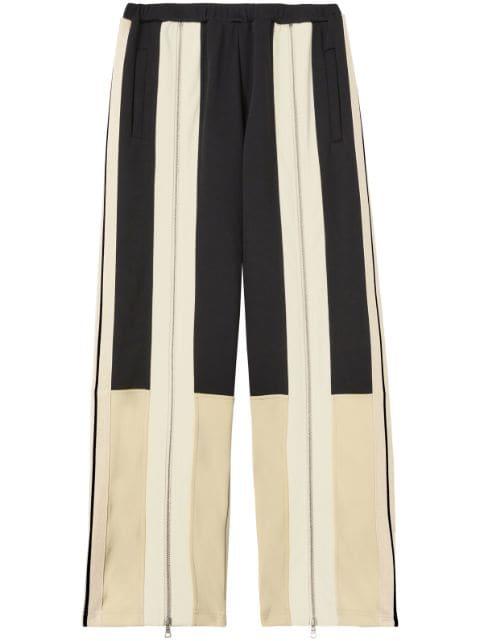 zip-detailing striped trousers by PALM ANGELS