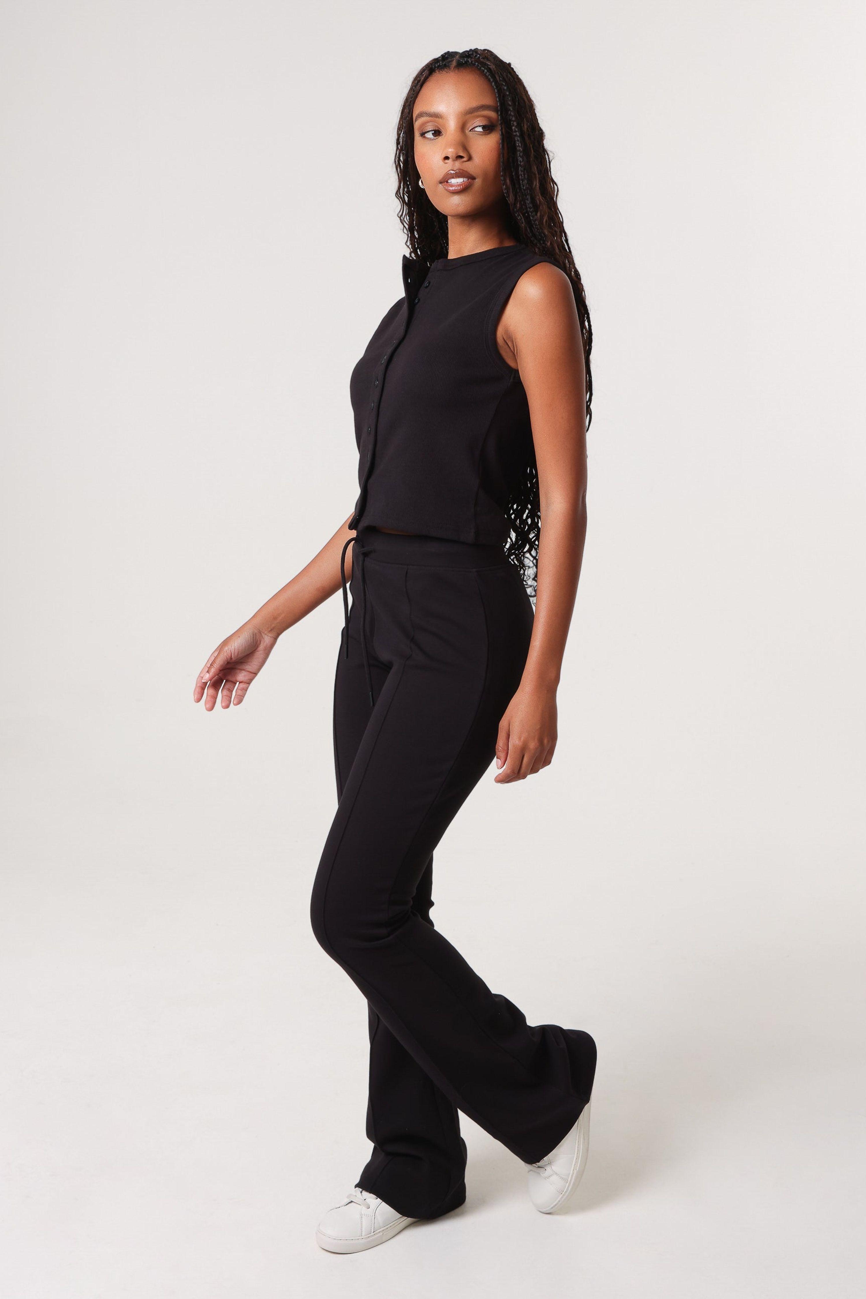 Black Pin Tuck Jersey Flares by PINK VANILLA