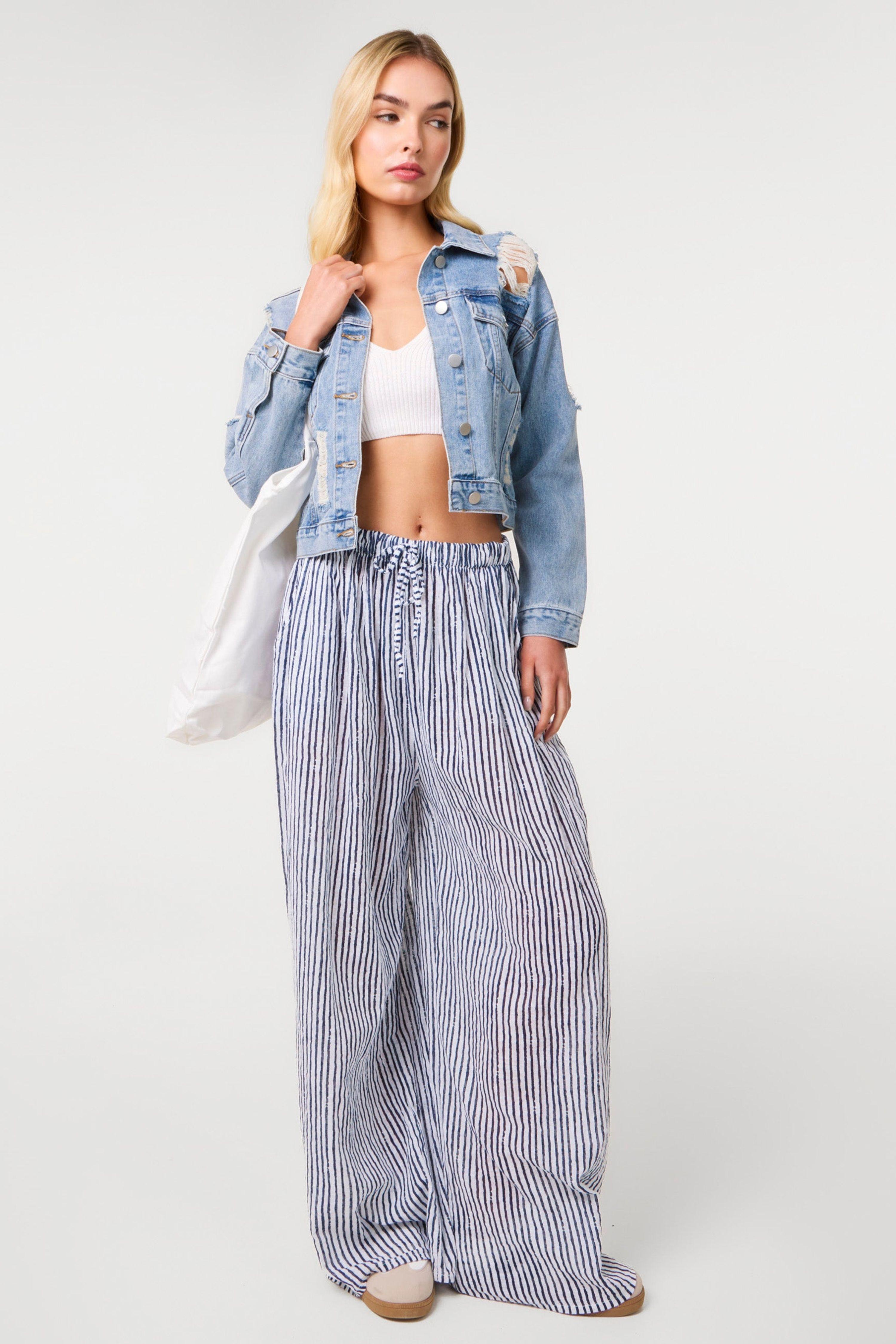Light Blue Distressed Cropped Denim Jacket by PINK VANILLA