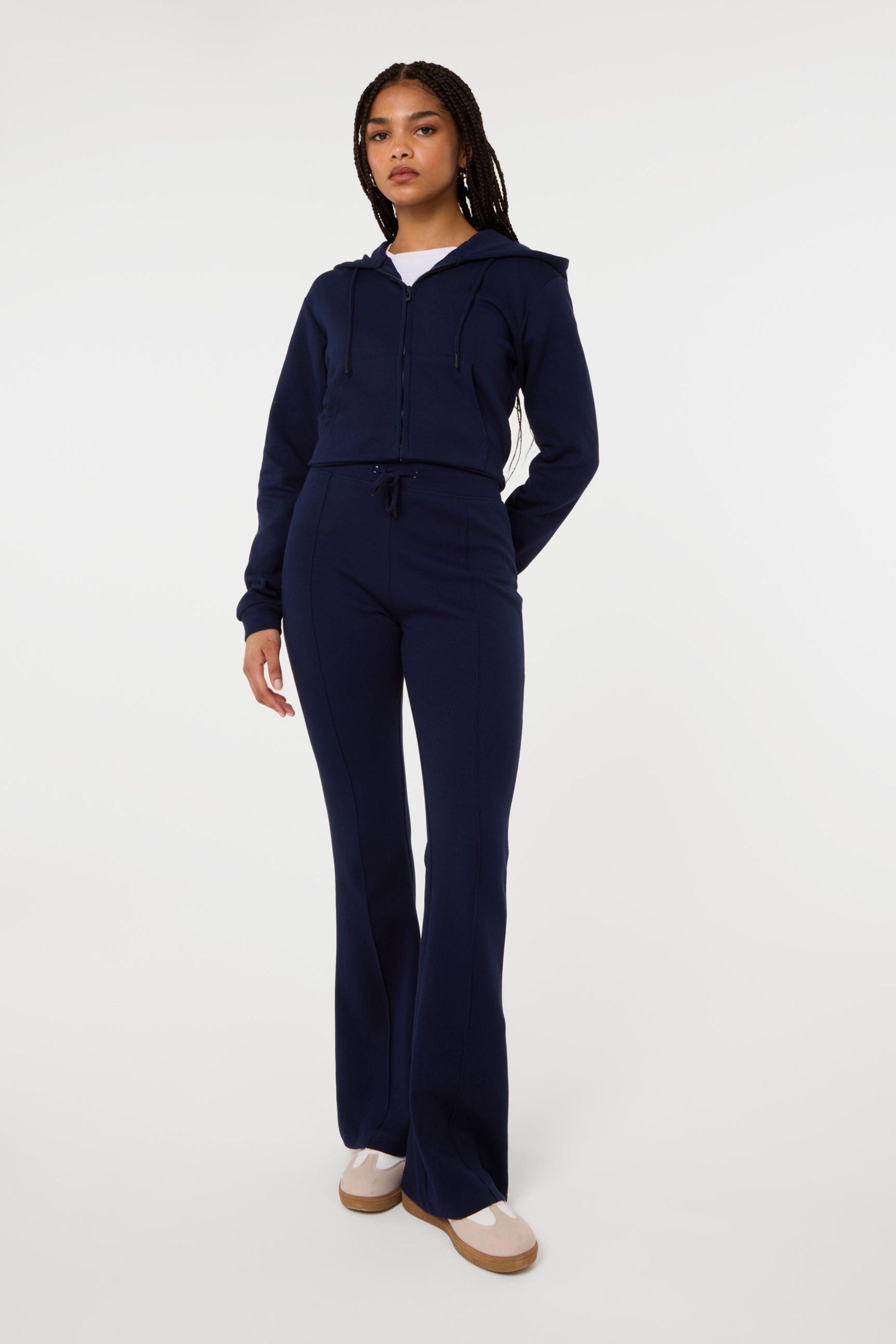 Navy Pin Tuck Jersey Flares by PINK VANILLA
