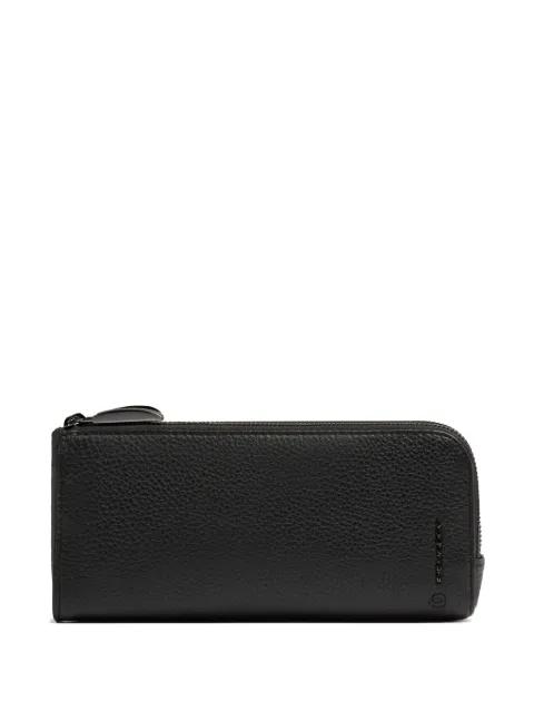 grained-leather clutch bag by PIQUADRO
