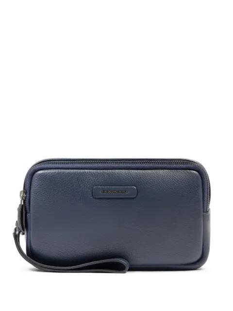 grained leather clutch bag by PIQUADRO