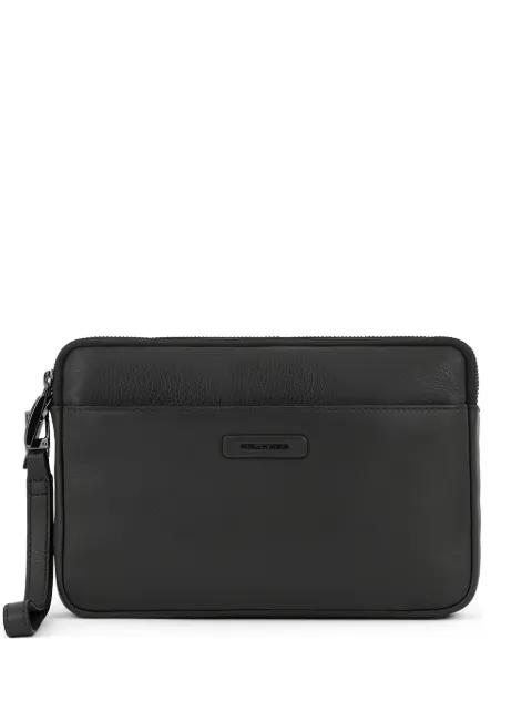 leather clutch bag by PIQUADRO