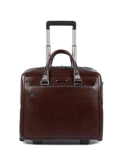 personalisable leather pilot bag by PIQUADRO
