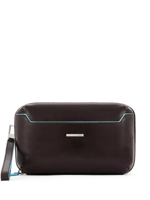 removable wrist-strap clutch bag by PIQUADRO