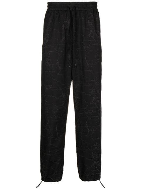 all-over logo print trousers by PORTS V